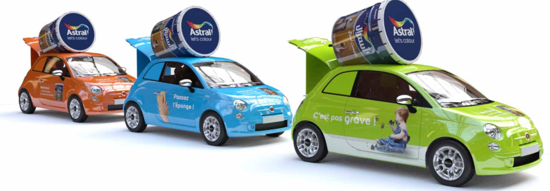 Rendu 3D : trois citadines habillées Astral, surmontées de pots de peinture géants.
